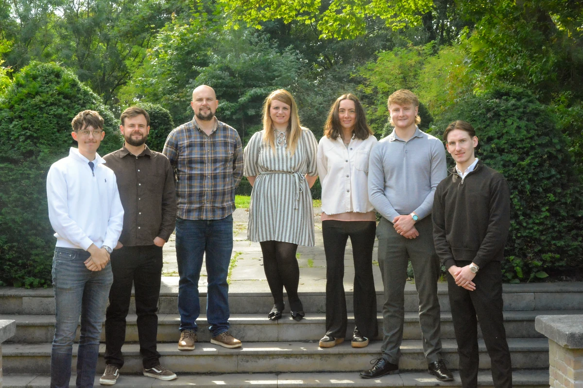 The Newton & Co team on the steps outside the office